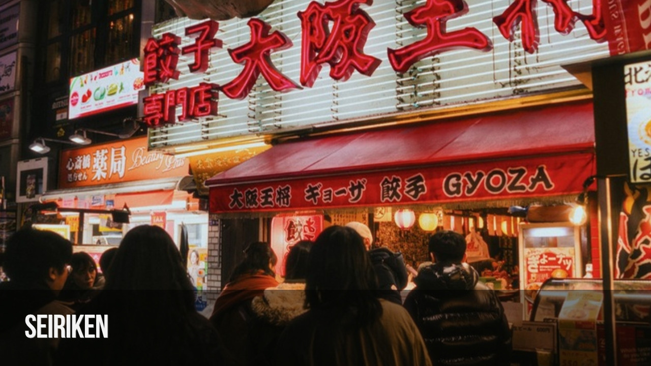 People queueing outside a busy restaurant in Japan at night