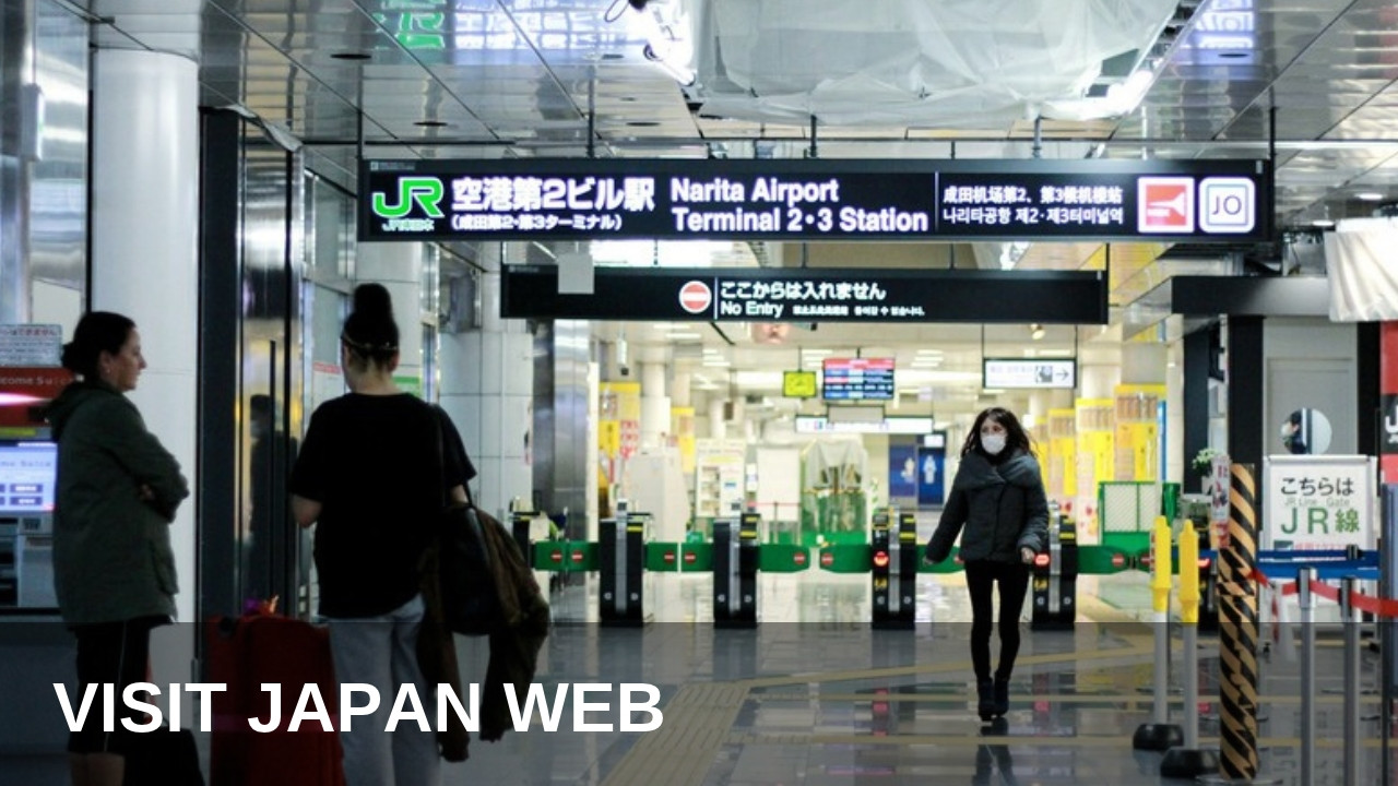 Travellers with suitcases at the Narita Airport railway station